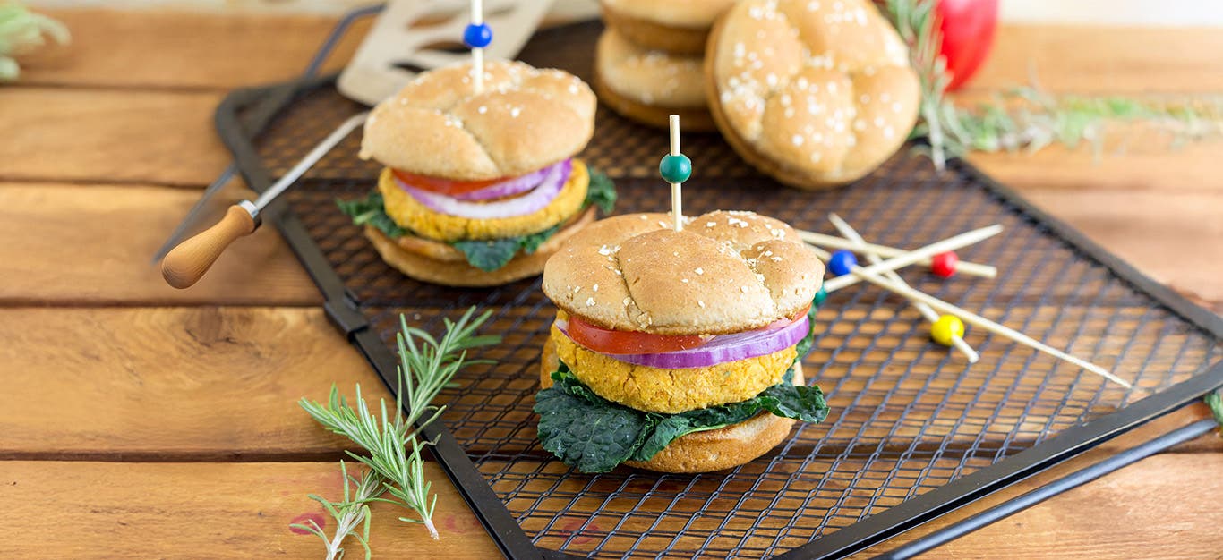 Chickpea Burgers on a wooden chopping board