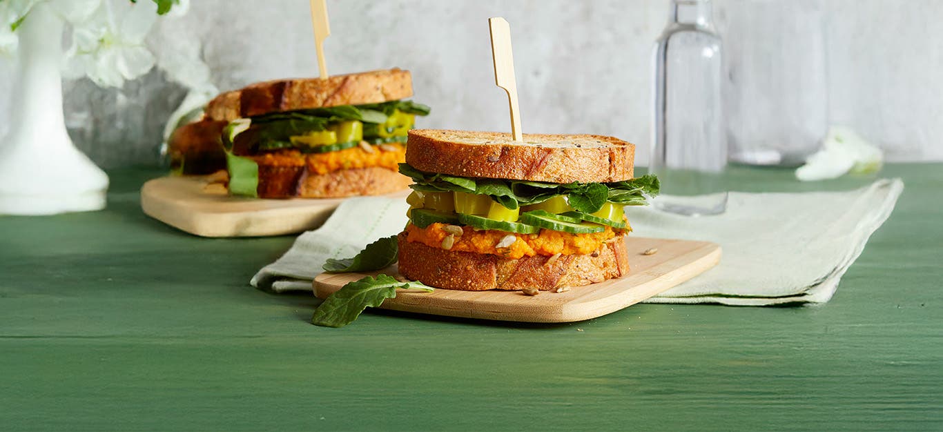 Greens and Things Sandwiches on a green tablecloth