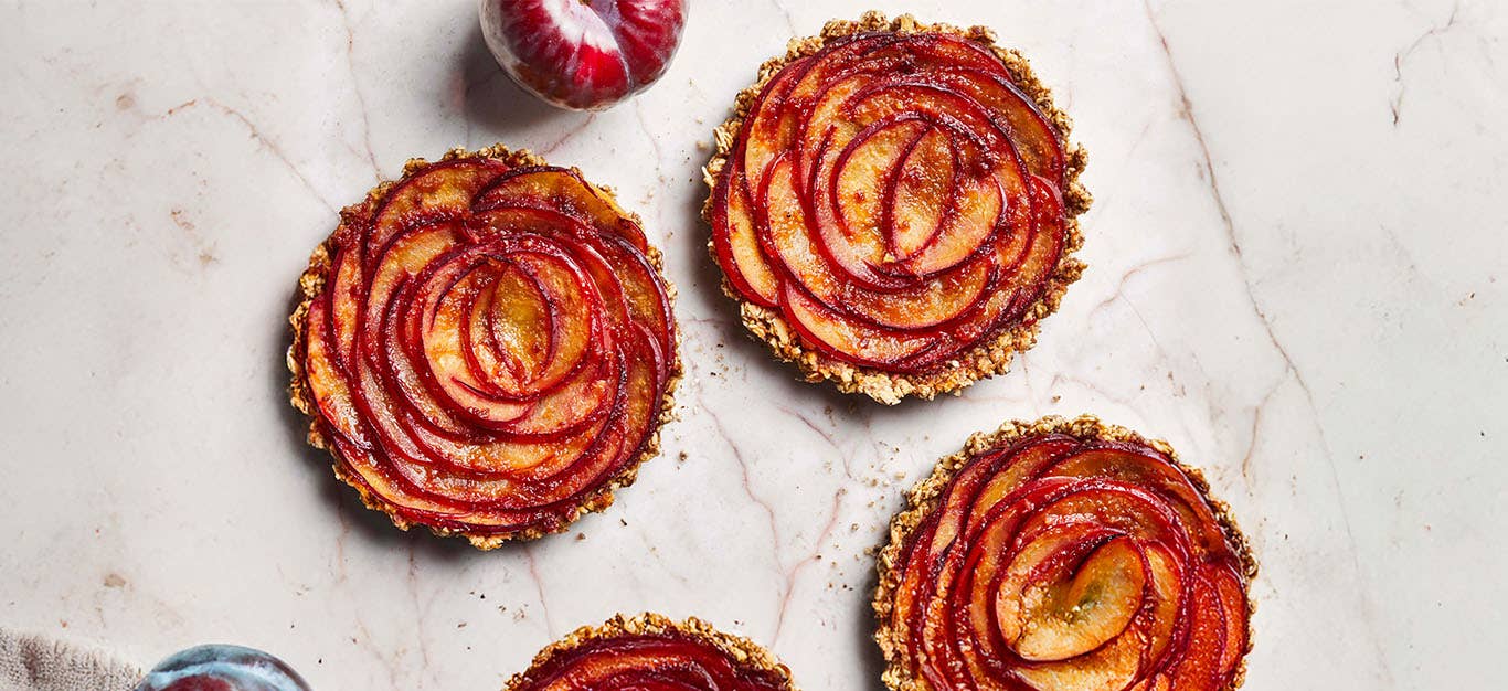 Plum Rosette Tarts on a marble counter