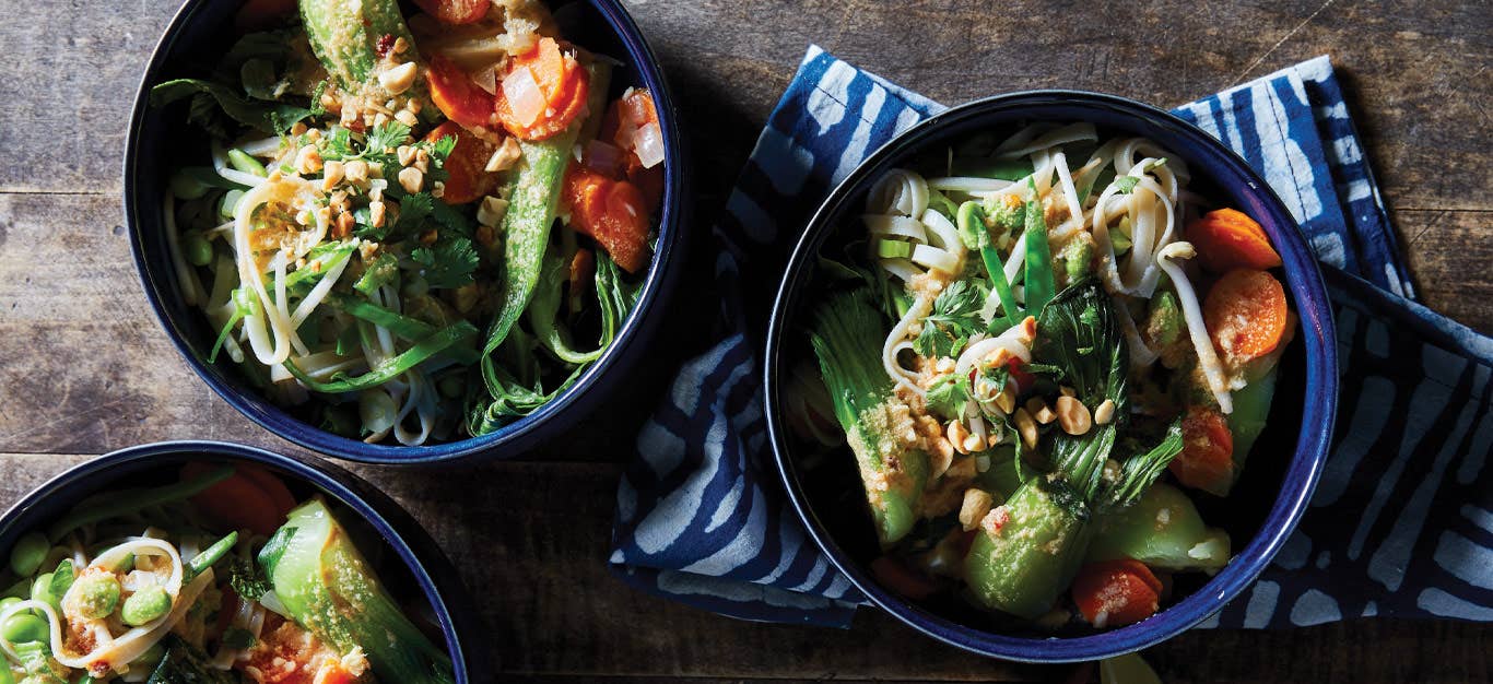 Thai Noodle Bowls with Bok Choy and Gluten-Free Peanut Sauce in dark blue ceramic bowls