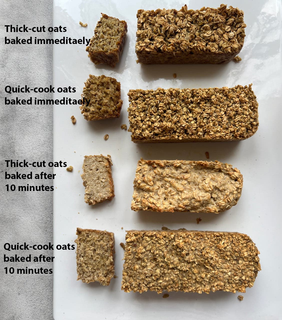 Four small loaves of Irish Porridge Bread with one slice cut off, showing how the loaf turned out when thick cut oats were used compared with quick-cook oats. 