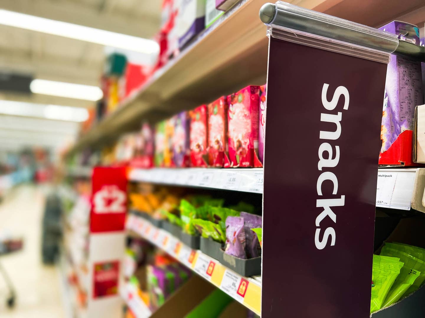 Grocery store snack aisle full of highly processed foods