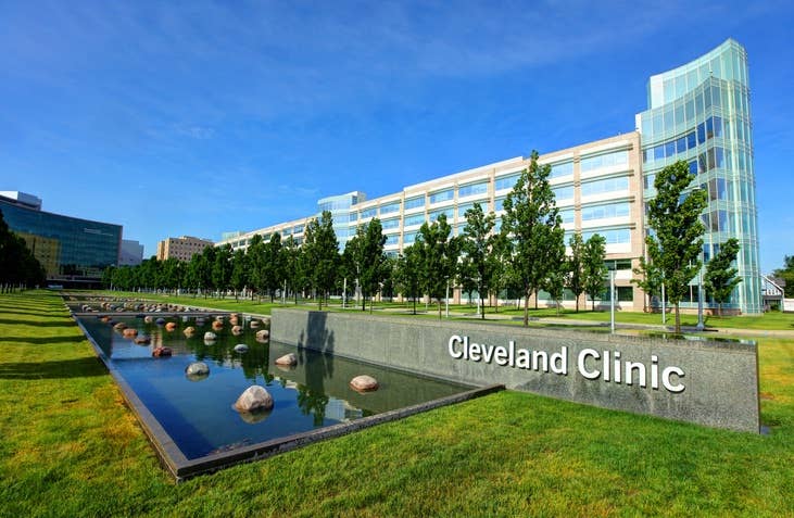 an exterior view of the Cleveland Clinic, with a fountain