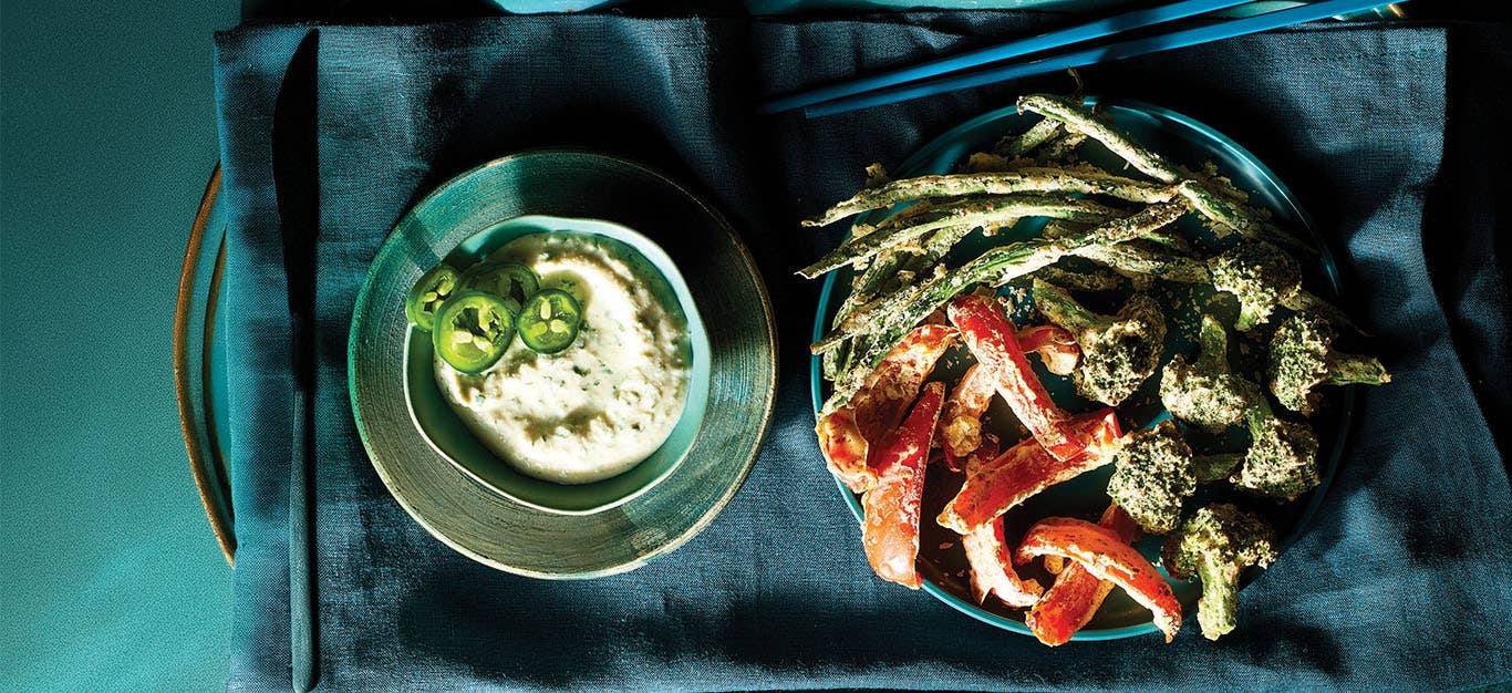 Air-Fried Tempura Veggies on a plate next to a small bowl of Jalapeño-Lime Sauce