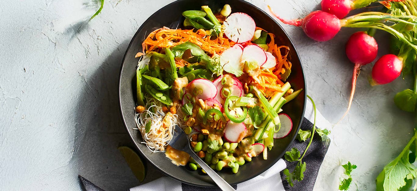 Spring Roll Bowl with whole radishes to the side
