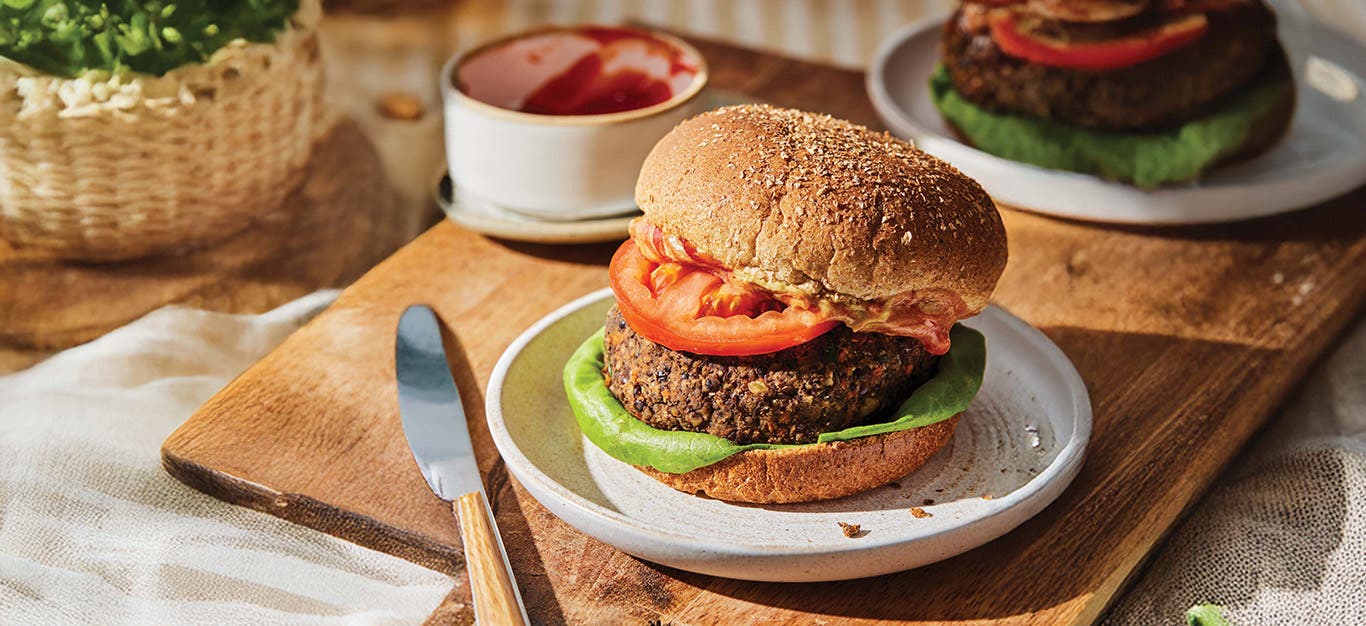 A 15-Minute Lentil Burgers ( on a plate on a wooden chopping board