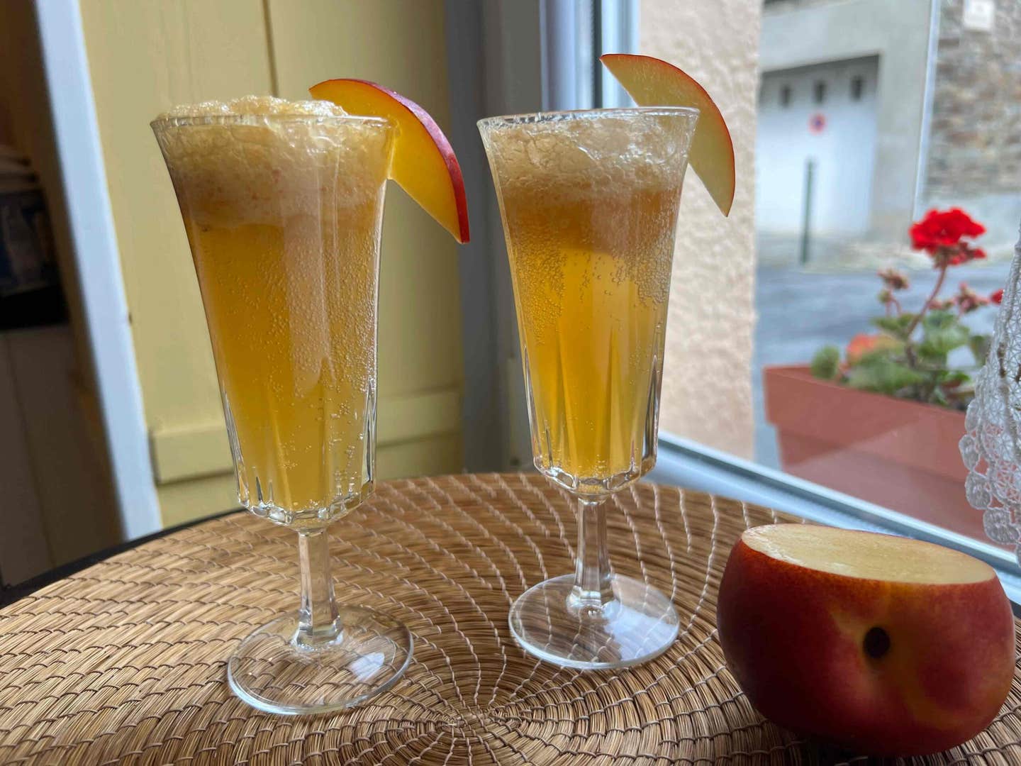 Two glasses of nectarine bellini, a light and healthy summer mocktail