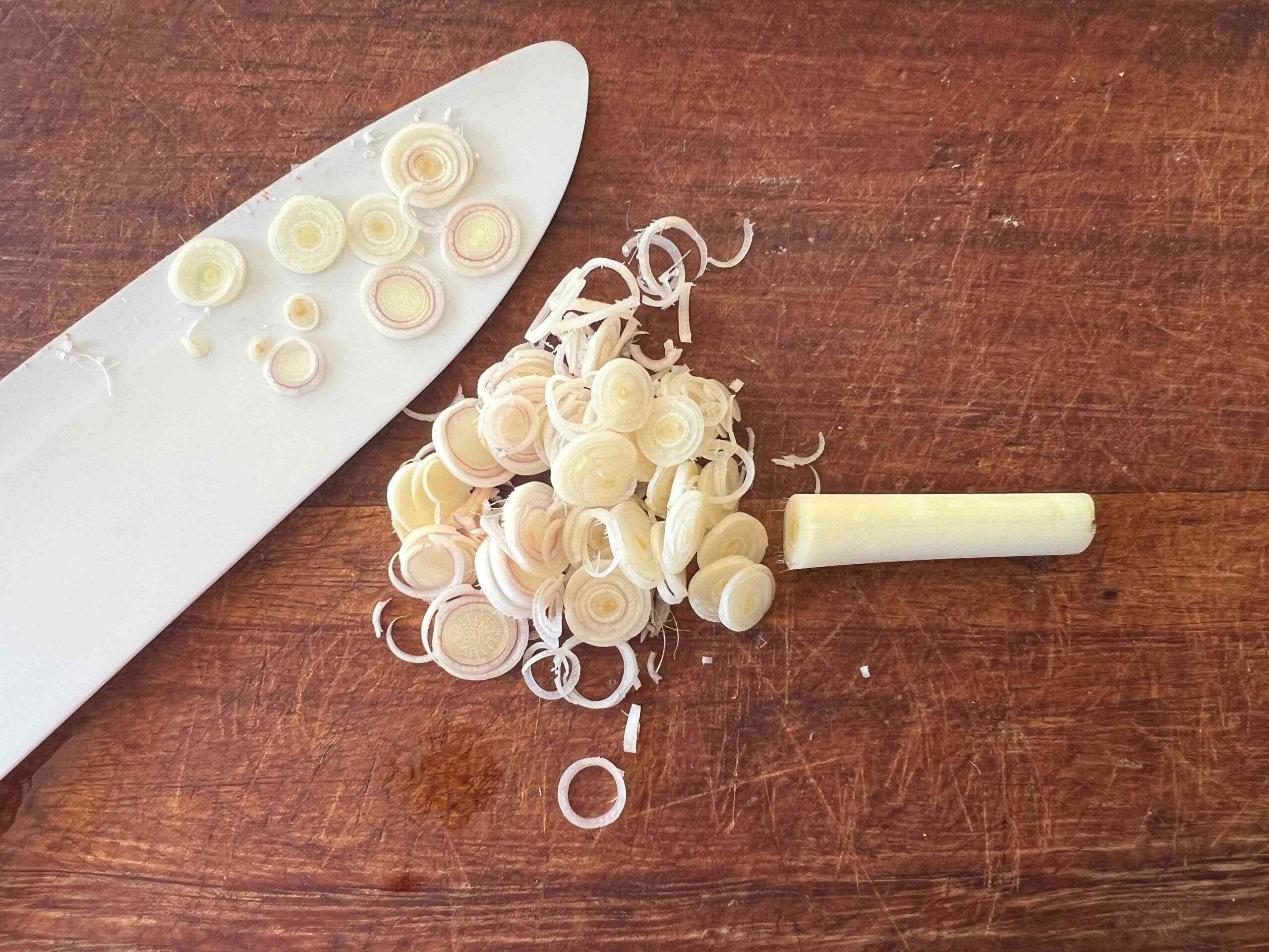 Sliced lemongrass on a cutting board