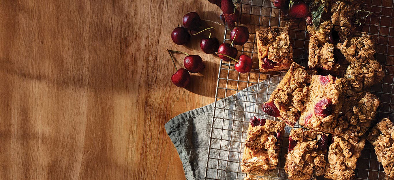 Slices of Cherry Coffee Cake on a wire cooling rack