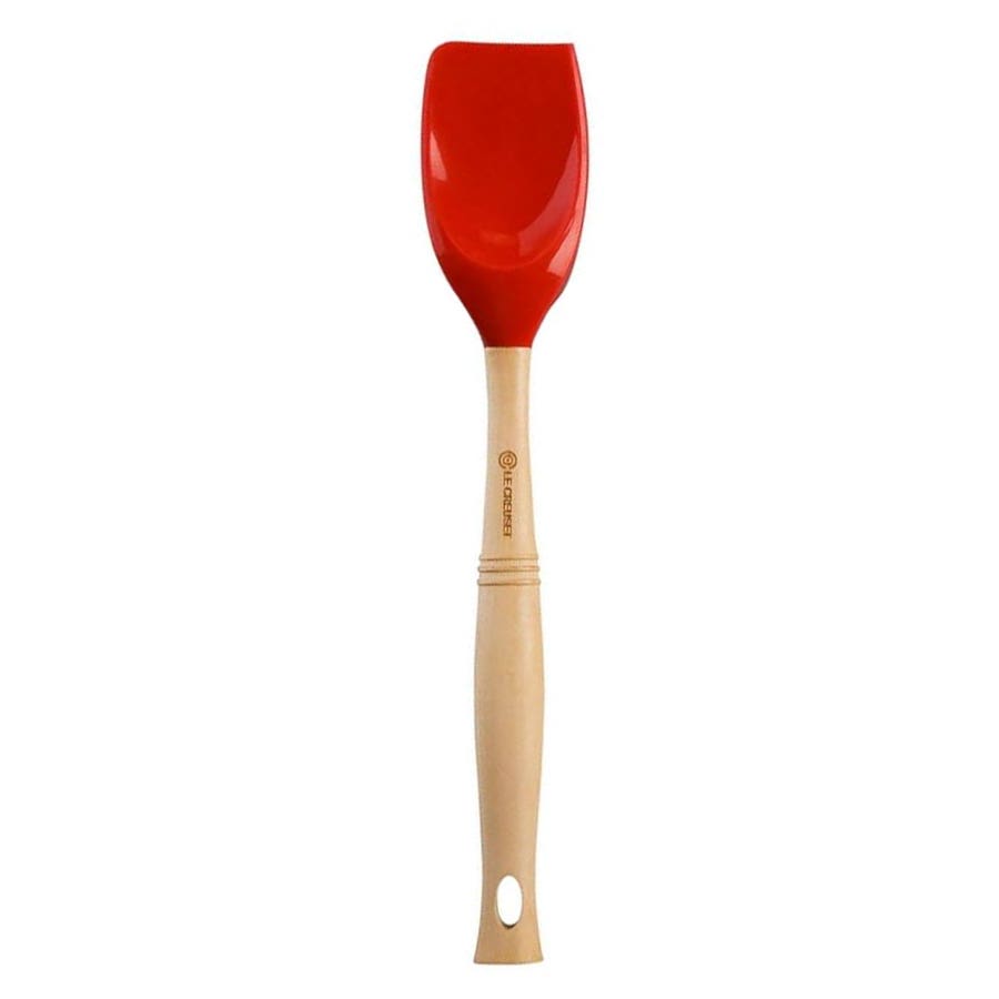 Le Creuset Silicone Spatula Spoon with a wooden handle and a red head