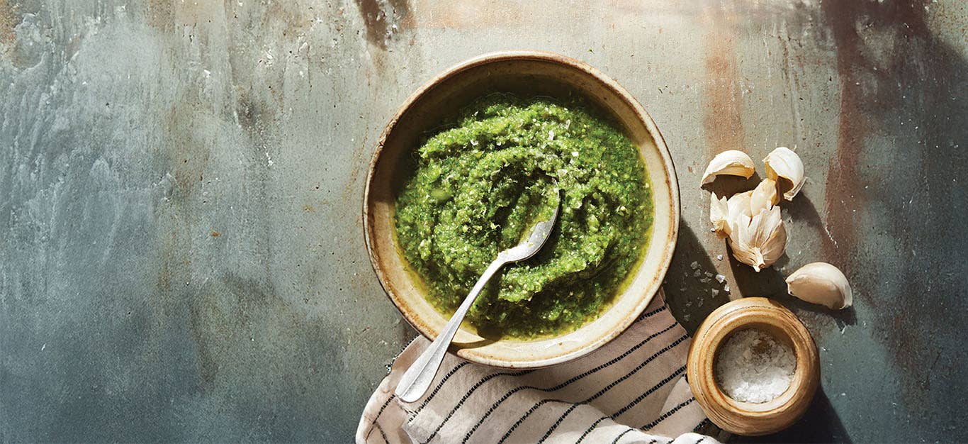 a small bowl of Roasted Poblano Salsa Verde with a teaspoon in the side