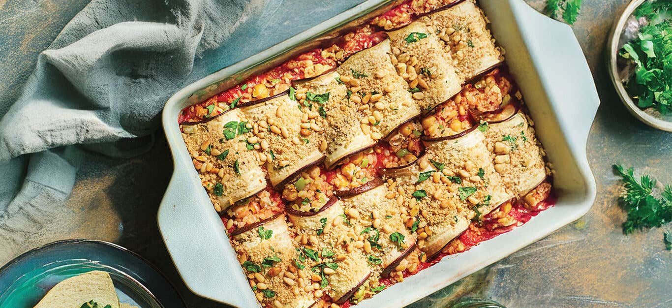 Risotto-Filled Eggplant Rollatini in a white casserole dish