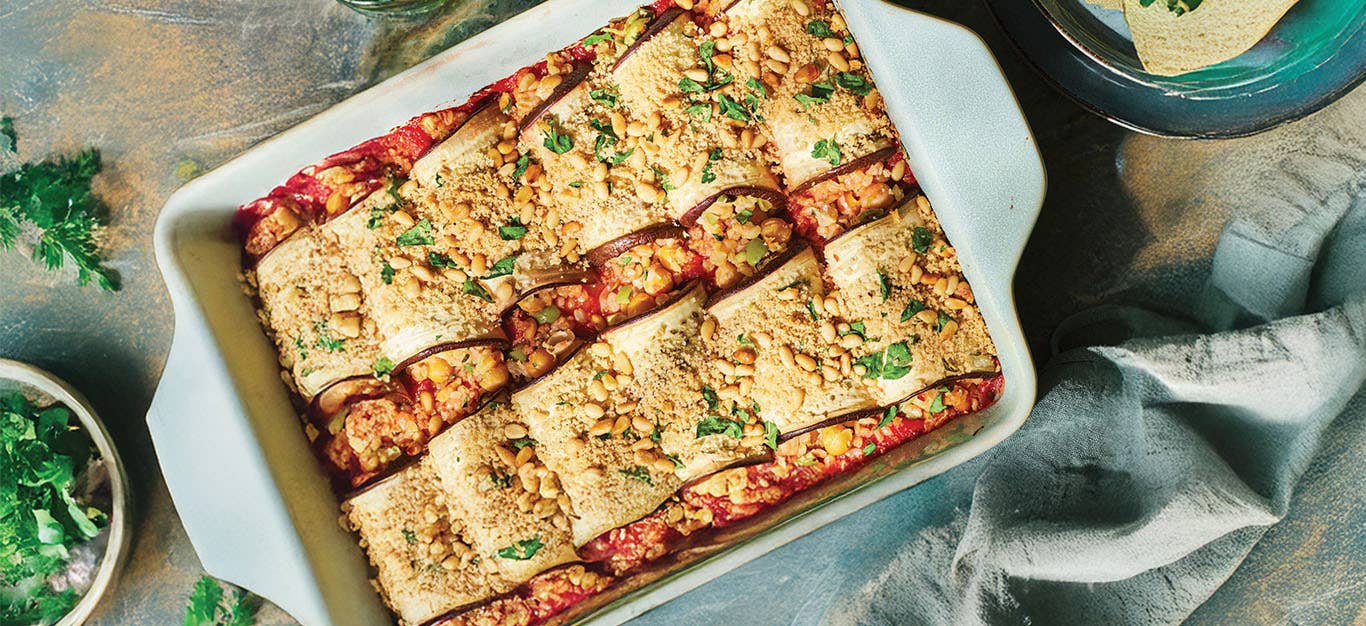 Risotto-Filled Eggplant Rollatini in a white casserole dish