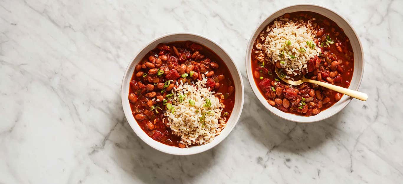 Two bowls of 30-Minute Chili with a spoonful of brown rice in each