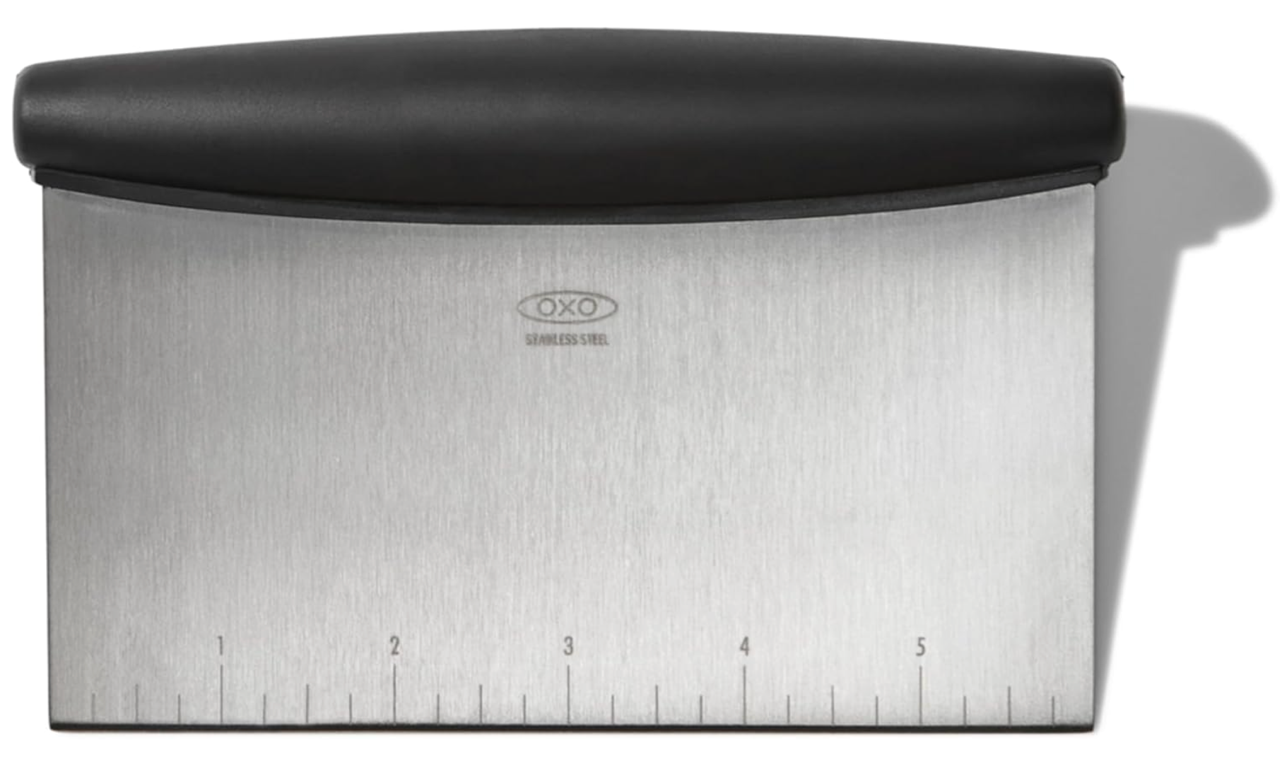 Closeup of an Oxo Bench Scraper with a black rubber grip