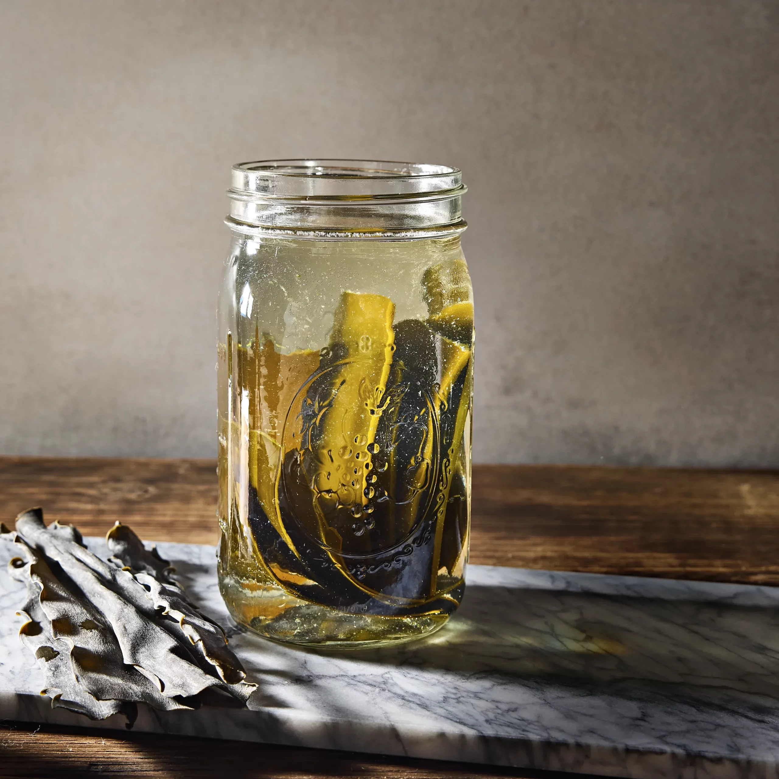Cold brew dashi in a large Mason jar, with moody natural lighting