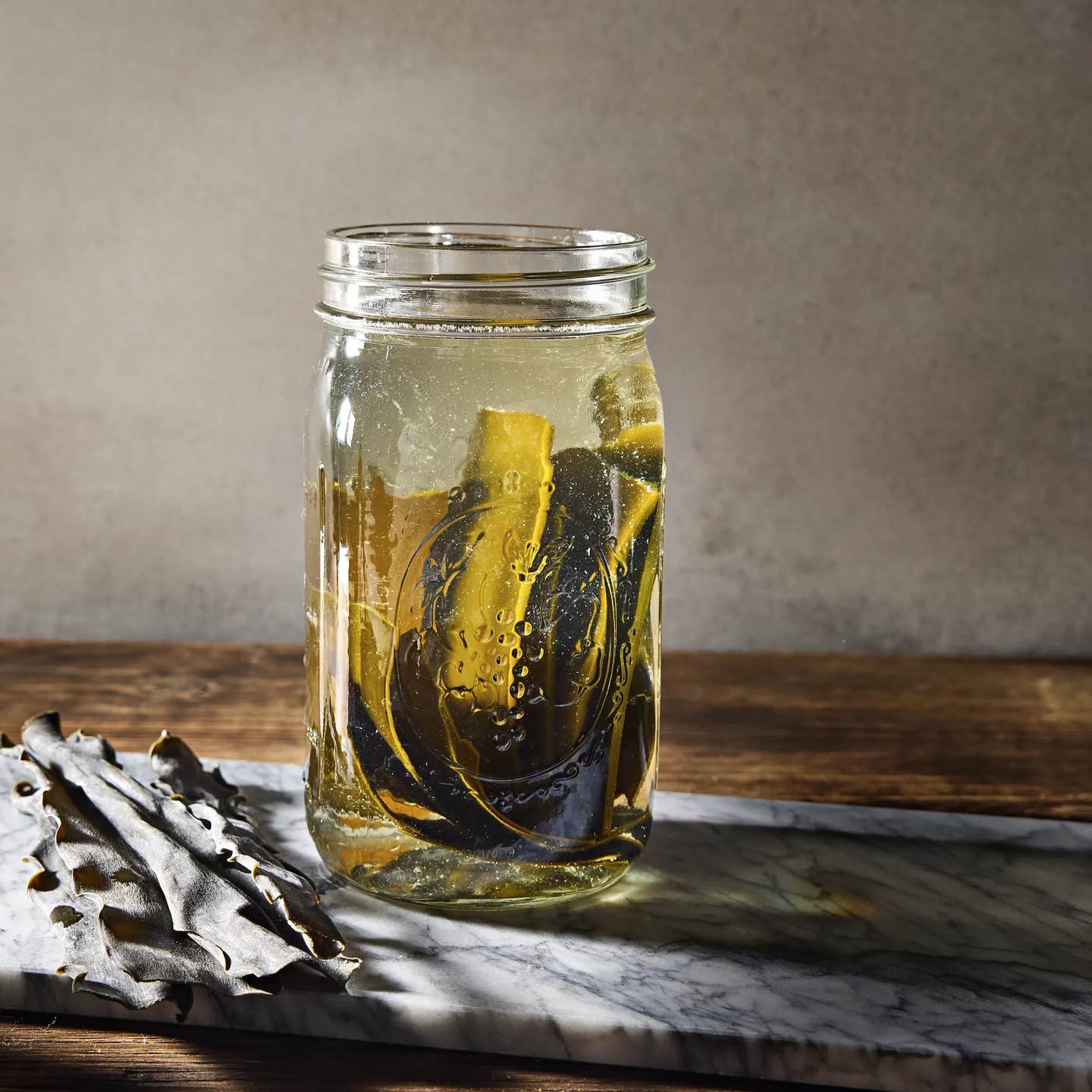 Cold brew dashi in a large Mason jar, with moody natural lighting