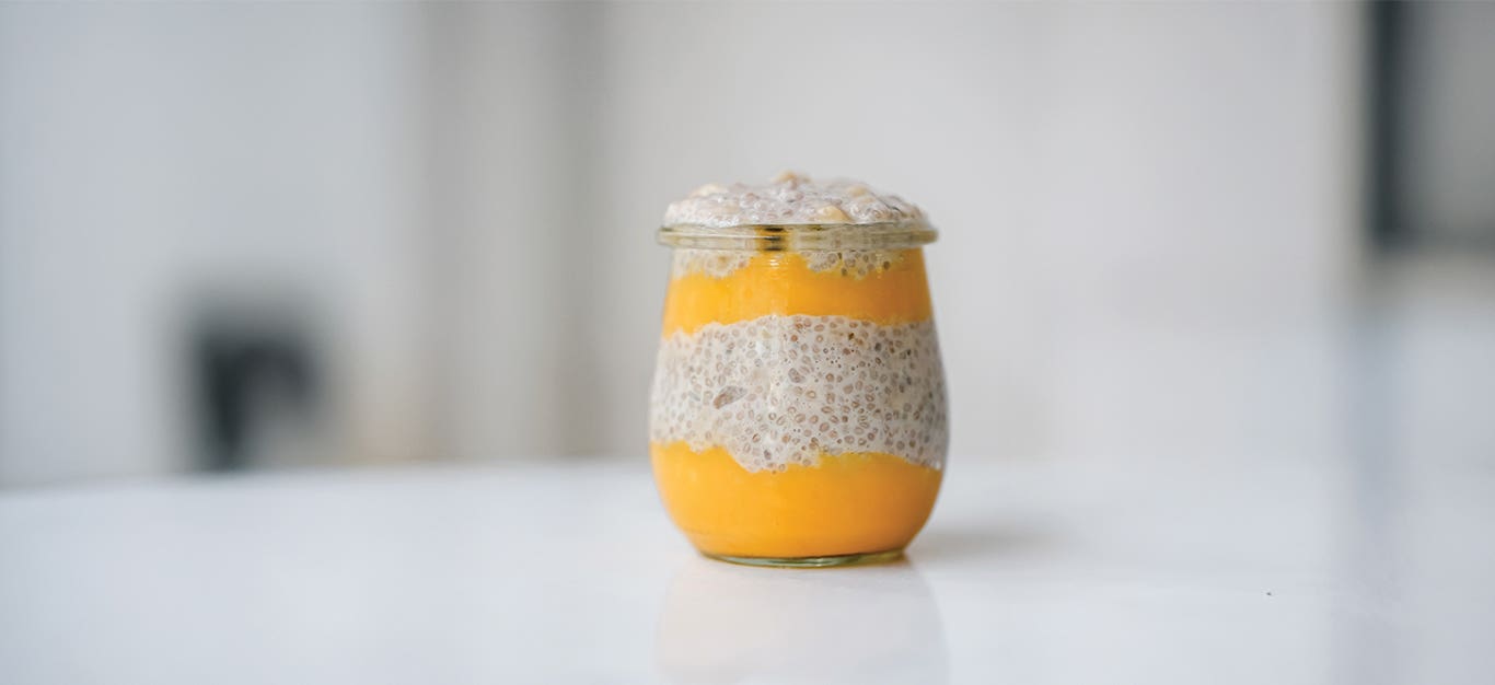 Tropical Chia Pudding with alternating layers of mango and chia