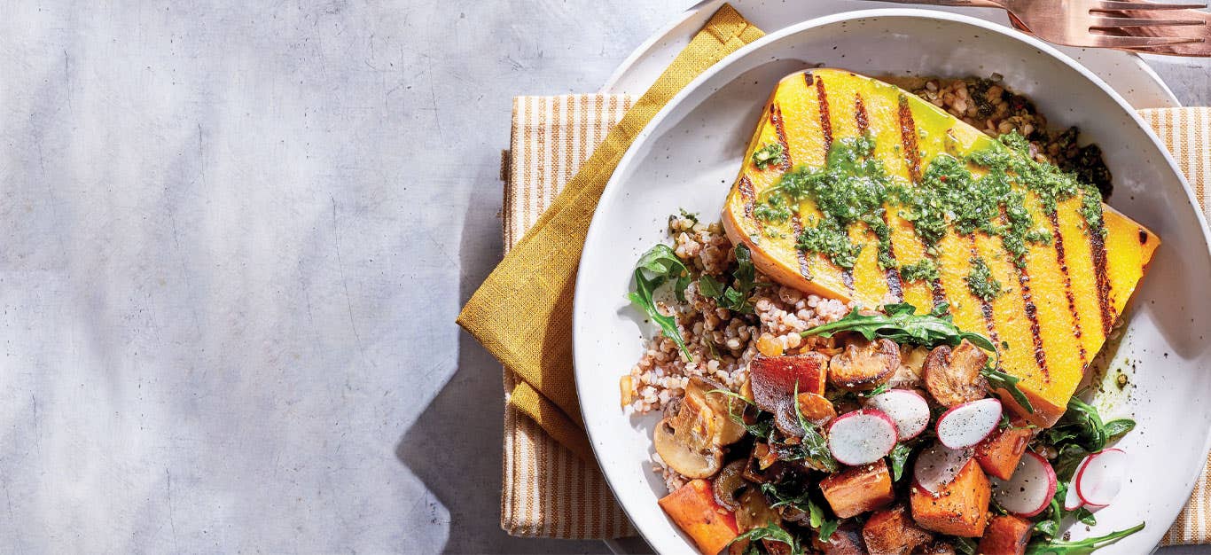 Butternut Squash Steak Supper in a white bowl against a white marble background