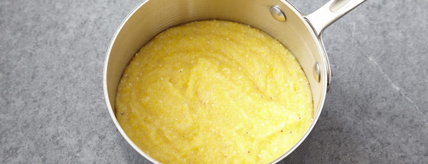 This basic polenta recipe can be served soft and creamy, or allowed to set and be cut and used in any number of dishes.