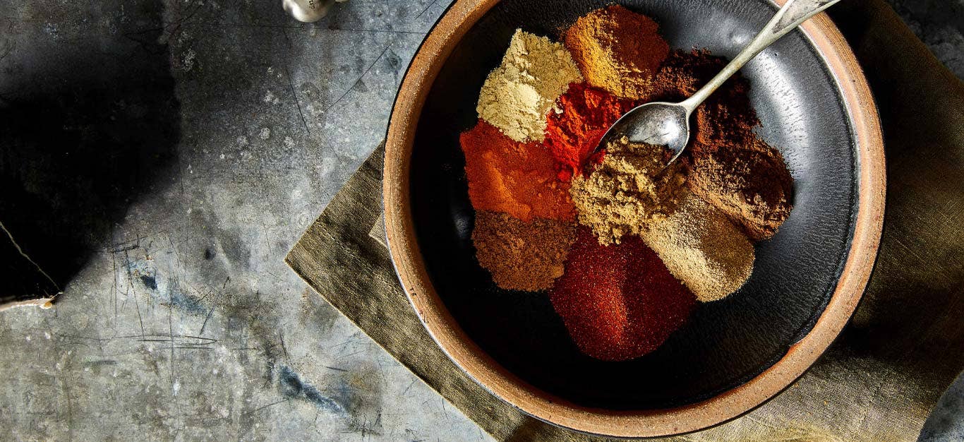 Homemade Berbere Spice Blend in a wooden bowl with a metal spoon