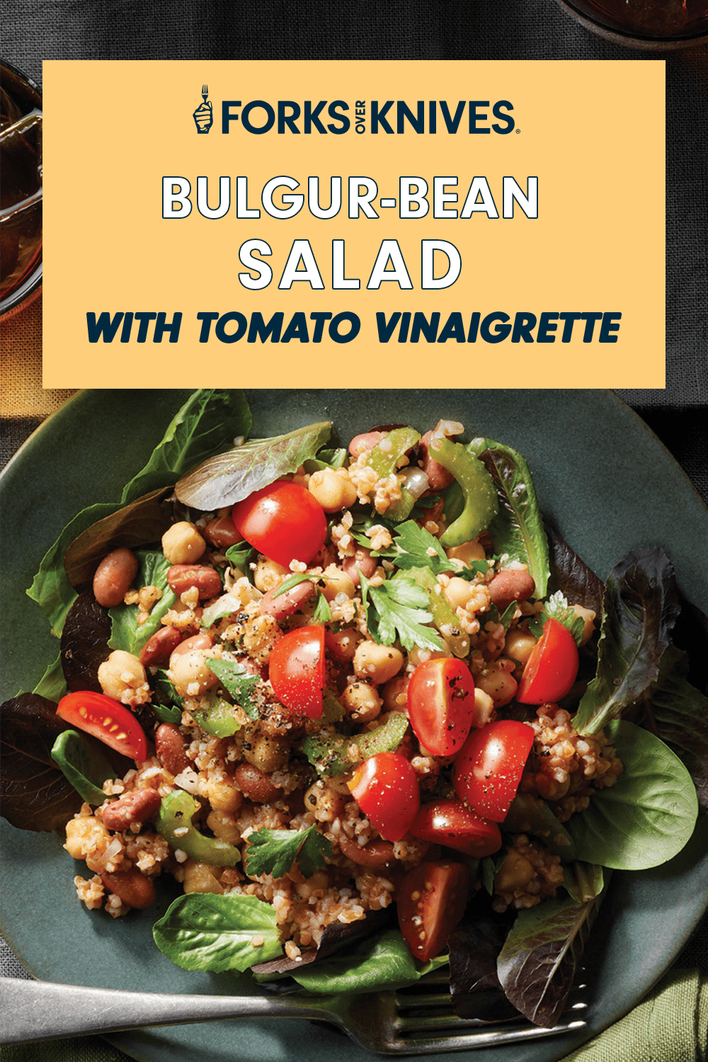 A vibrant looking vegan salad in a black bowl, next to text that reads, "Bulgur-Bean Salad with Tomato Vinaigrette"