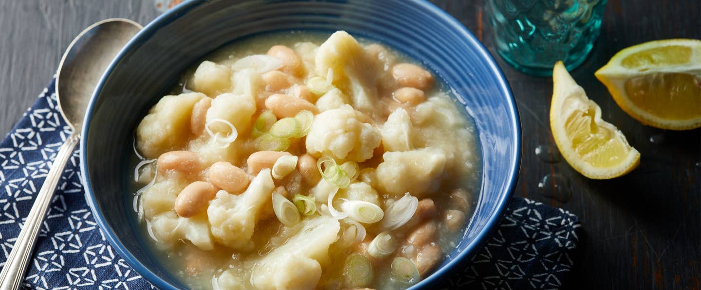 Creamy Caulilflower and White Bean Soup in blue bowl