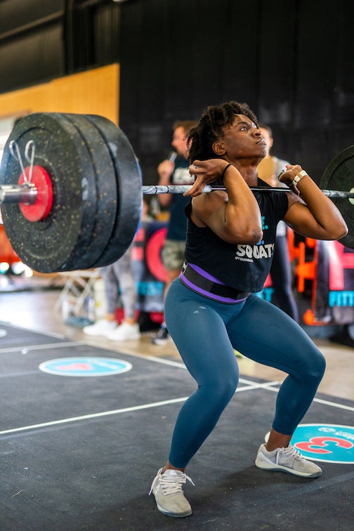 Vegan CrossFit athlete Briana Jones deadlifting weights in a gym as she prepares to compete in the Mr America competition as part of the Vegan Strong Plantbuilt team