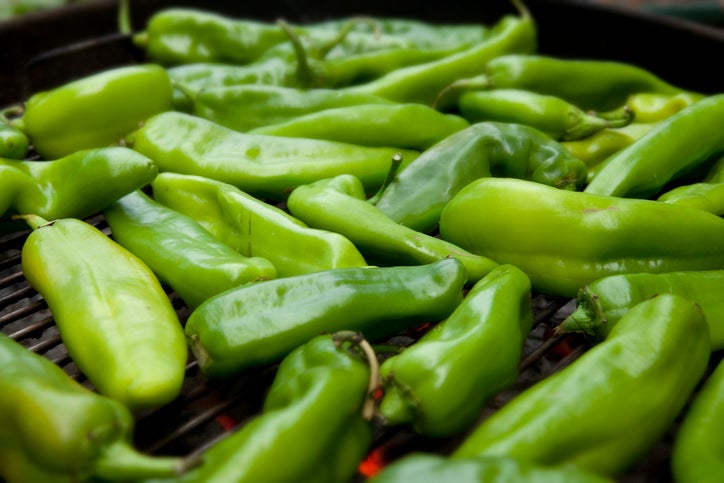 Hatch Chiles roasting over a fire