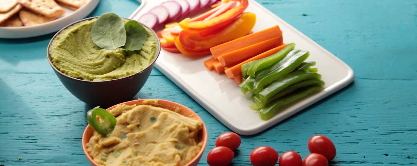 creamy oil-free hummus shown alongside a tray of crudites