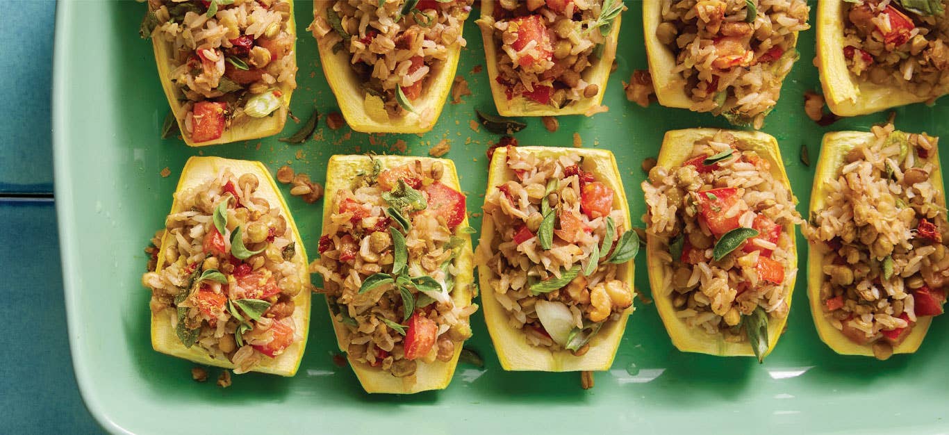Summer Squash Boats with Lentil-Rice Stuffing on a mint green serving tray