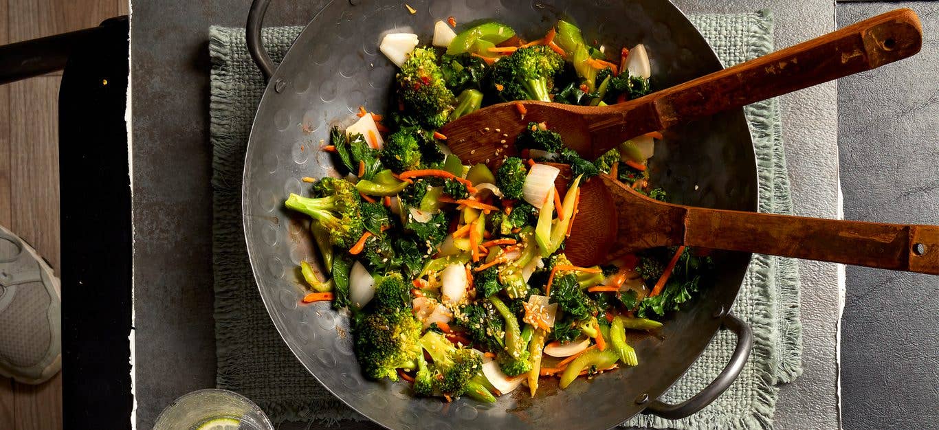 Ginger-Soy Veggie Stir-Fry in a wok with wooden serving spoons