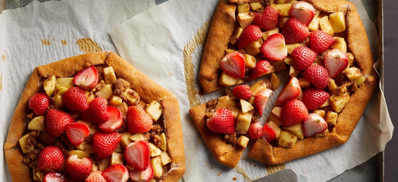 Strawberry-Apple Walnut Galettes on parchment paper