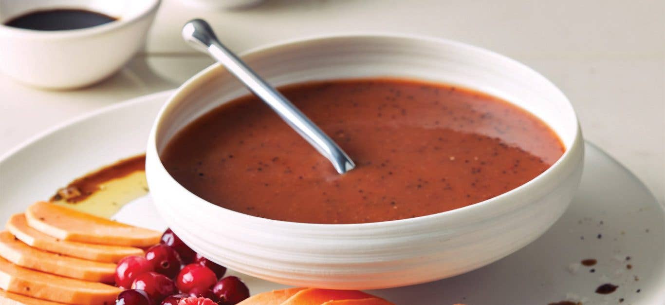 Sweet Potato Poppy Seed Dressing in a white bowl with a metal spoon