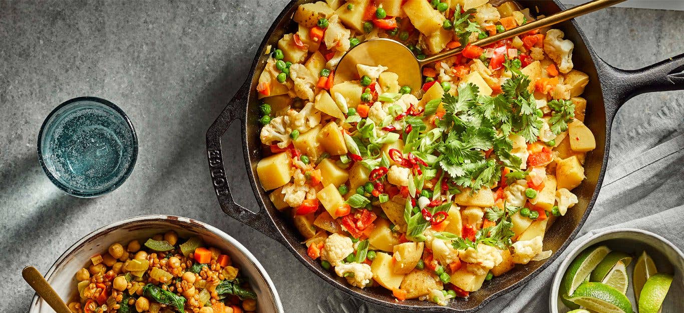 Thai Green Curry Potato and Pea Breakfast Hash in a cast iron skillet