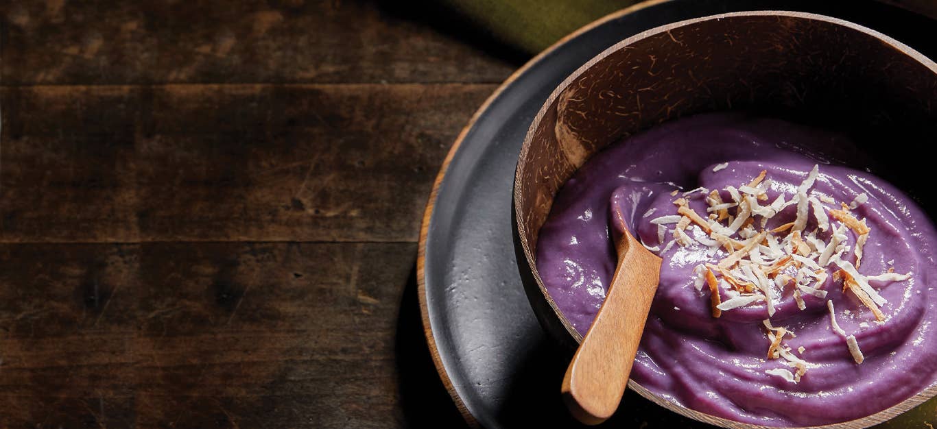 Vegan Ube Ice Cream in a wooden bowl with a wooden spoon