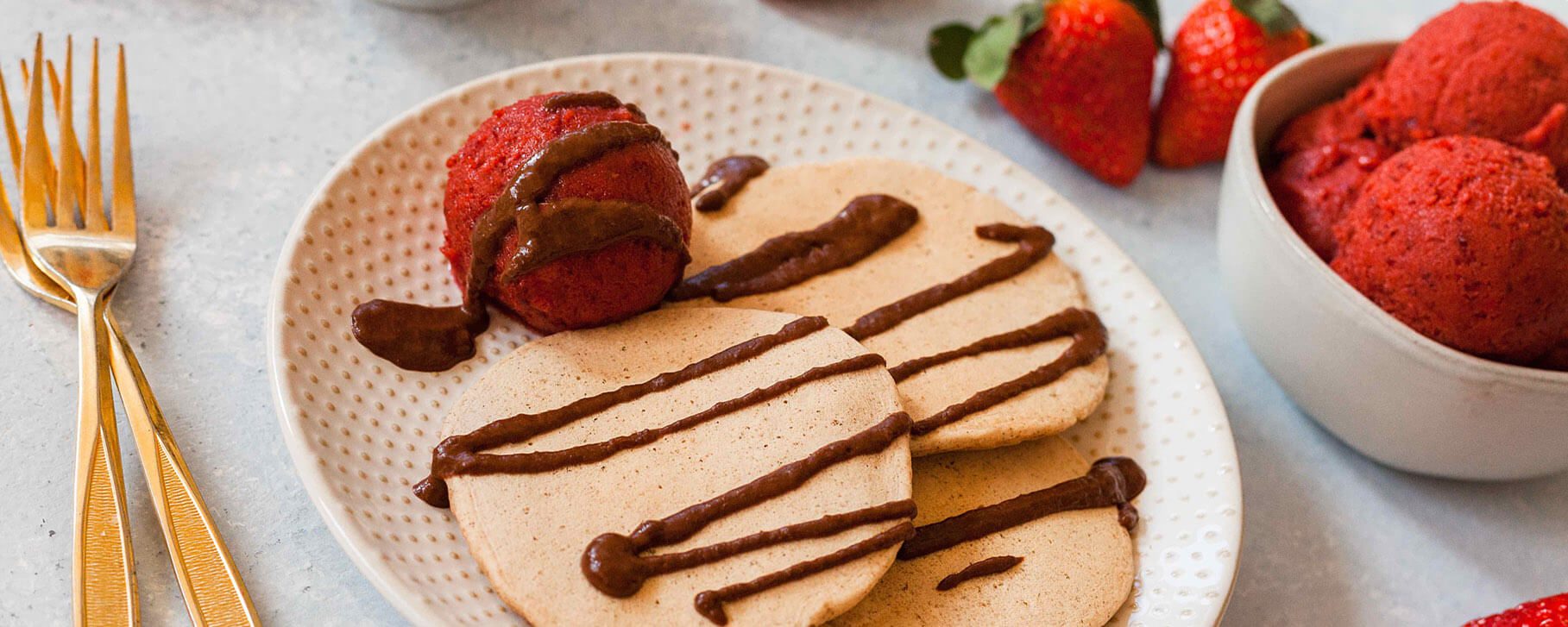 Vanilla Pancakes with Strawberry-Cherry Ice Cream and Warm Chocolate Sauce - Forks Over Knives