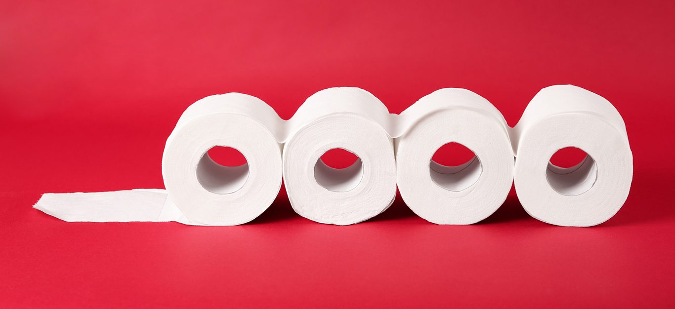 Toilet paper on red background