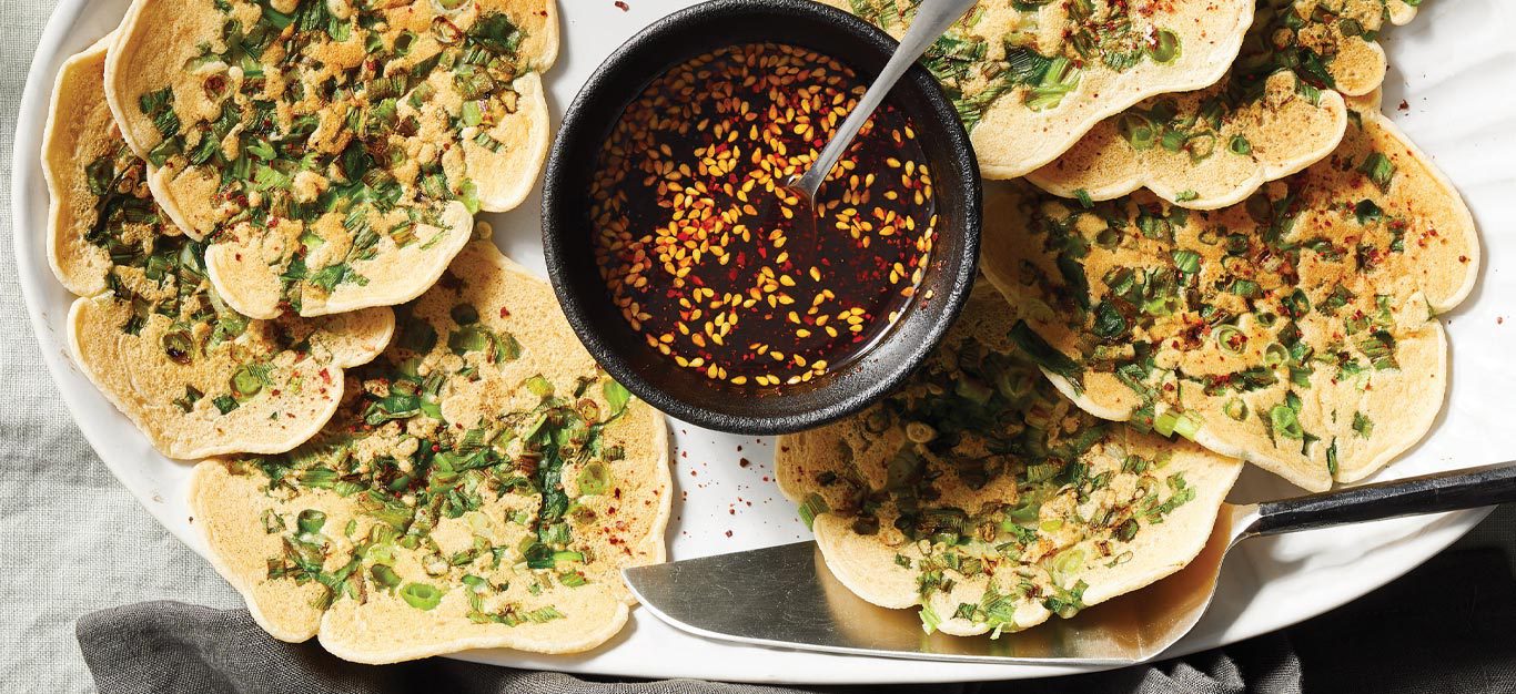 Oil-Free Scallion Pancakes with Spicy Soy Sauce on a white serving platter