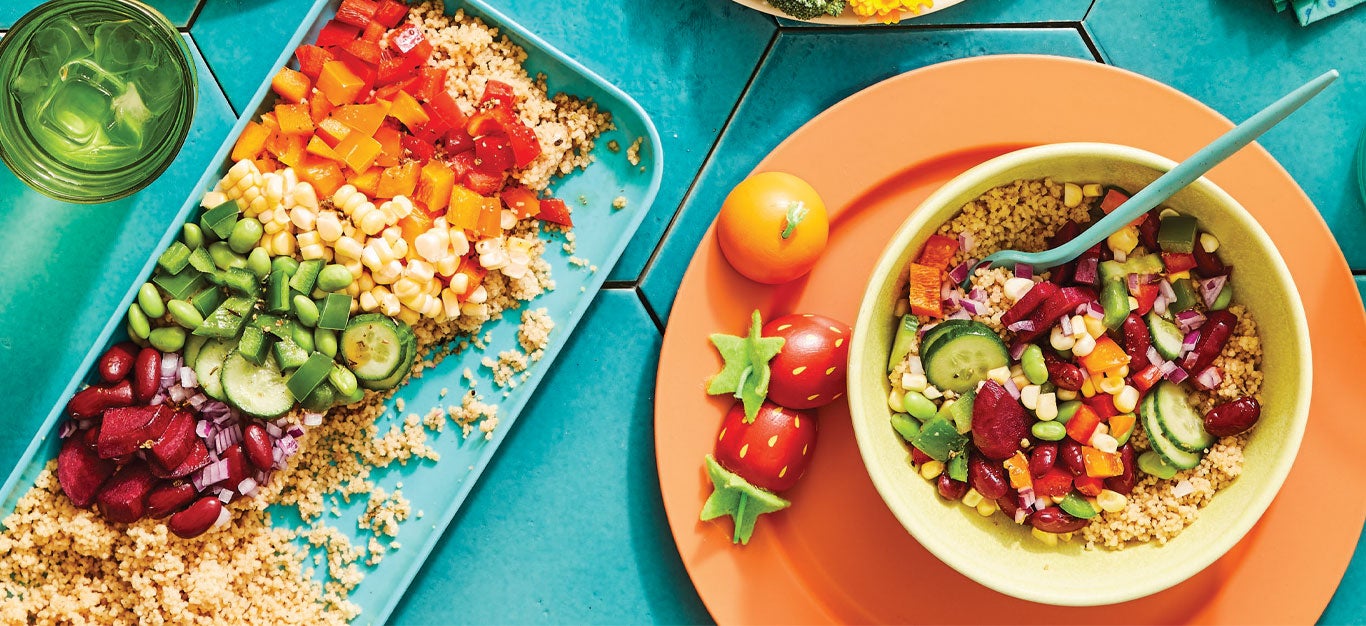 Kid-Friendly Rainbow Salad on a turquoise platter and in a yellow bowl