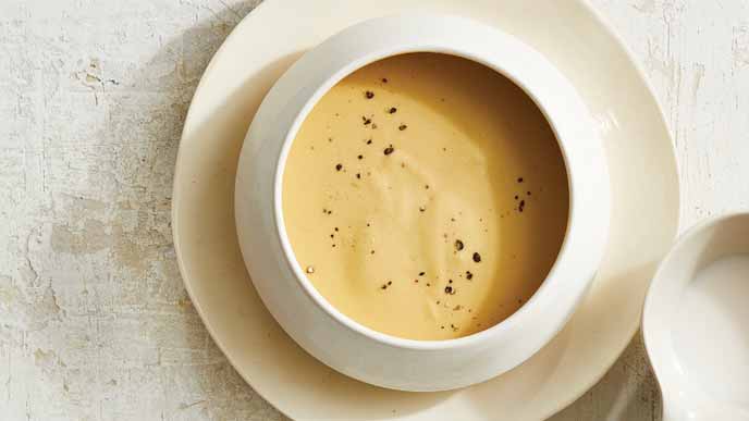 Velvety Cheese Sauce in a white ceramic bowl