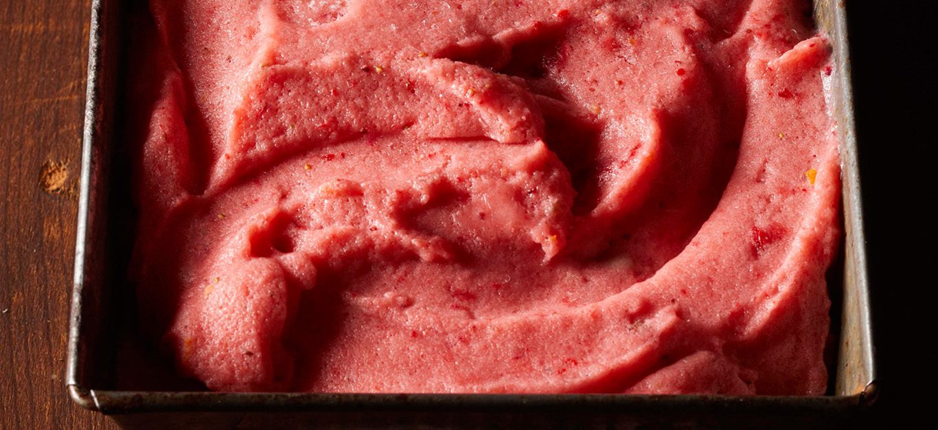 Close-up shot of red-pink strawberry-lemonade vegan ice cream