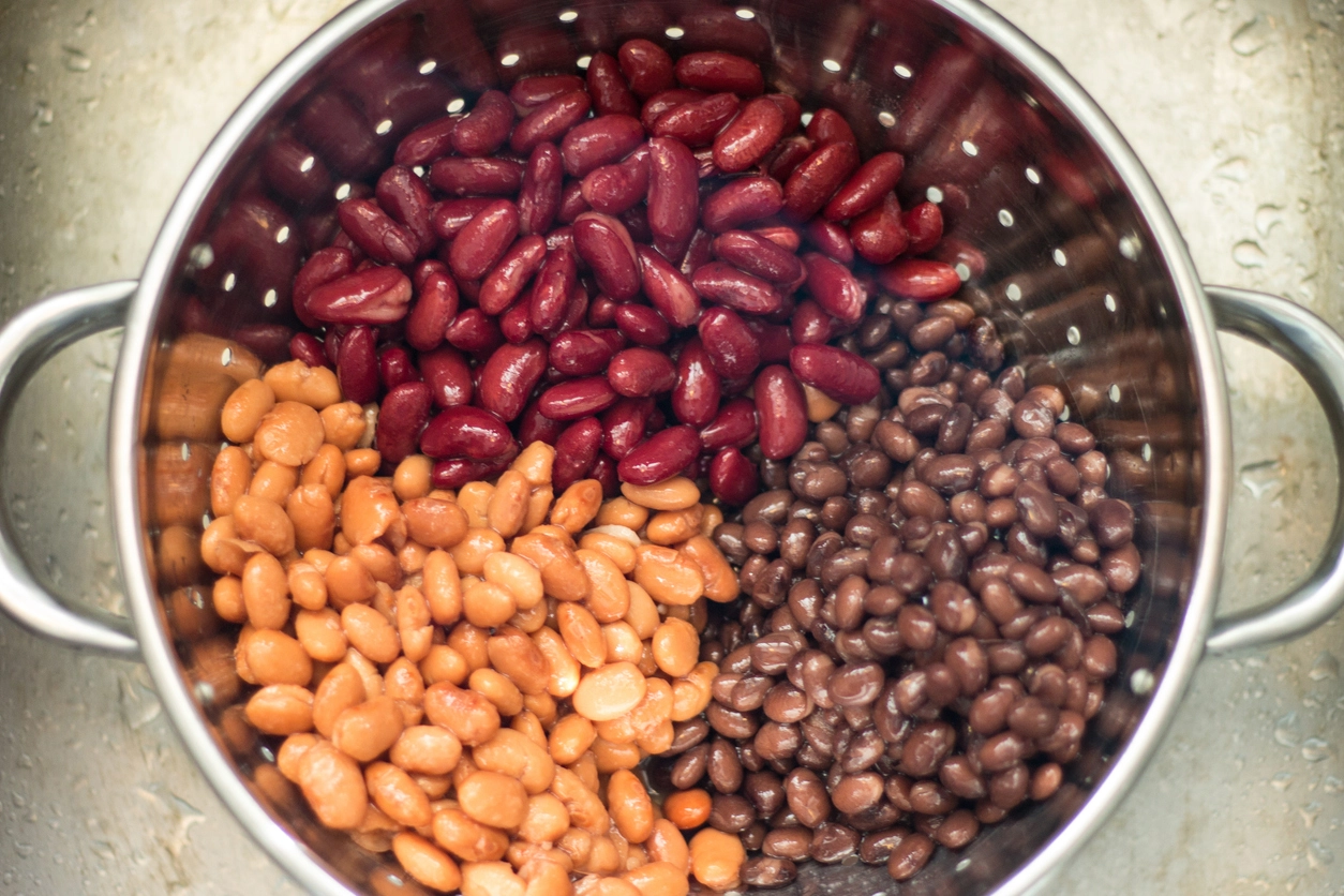 cooked kidney beans, pinto, and black beans in a colander