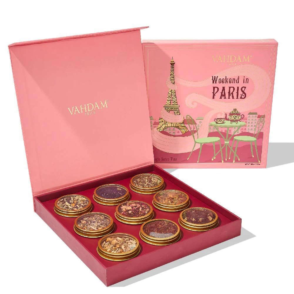 "Weekend in Paris" themed tea set in a pink box with nine round glass jars of different teas