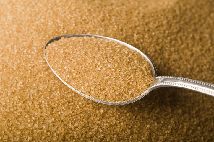 unrefined raw cane sugar in a spoon