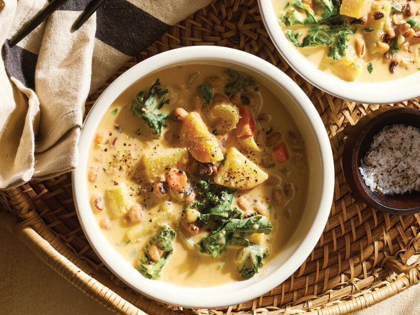 Two white serving bowls of Potato-Kale Black-Eyed Pea Soup