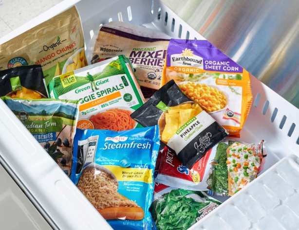 Healthy frozen plant based ingredients including mixed berries, brown rice, pineapple, and corn kernels