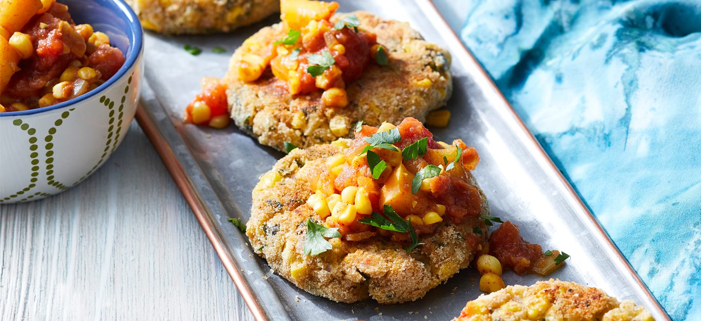 Chickpea and Corn Fritters with Tomato-Corn Chutney on a white platter