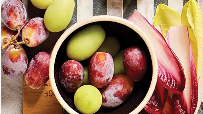 Frozen Grapes in a small beige ceramic bowl