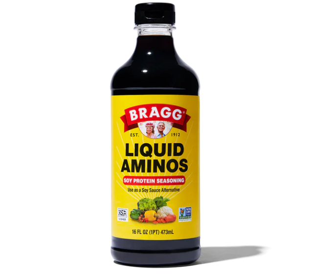 Bottle of Bragg liquid aminos on a white background